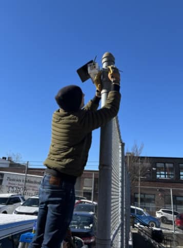 Clarity's air quality monitors being installed.